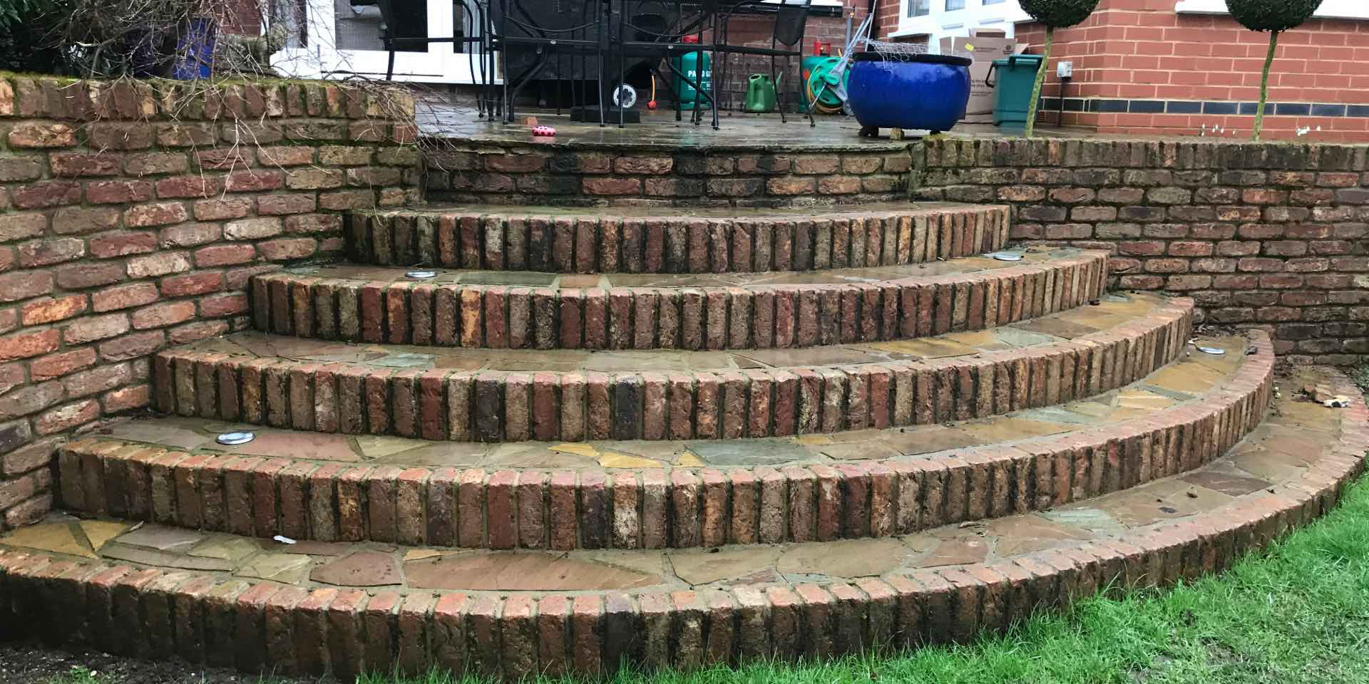 Steep flight of brick steps before landscaping work is undertaken