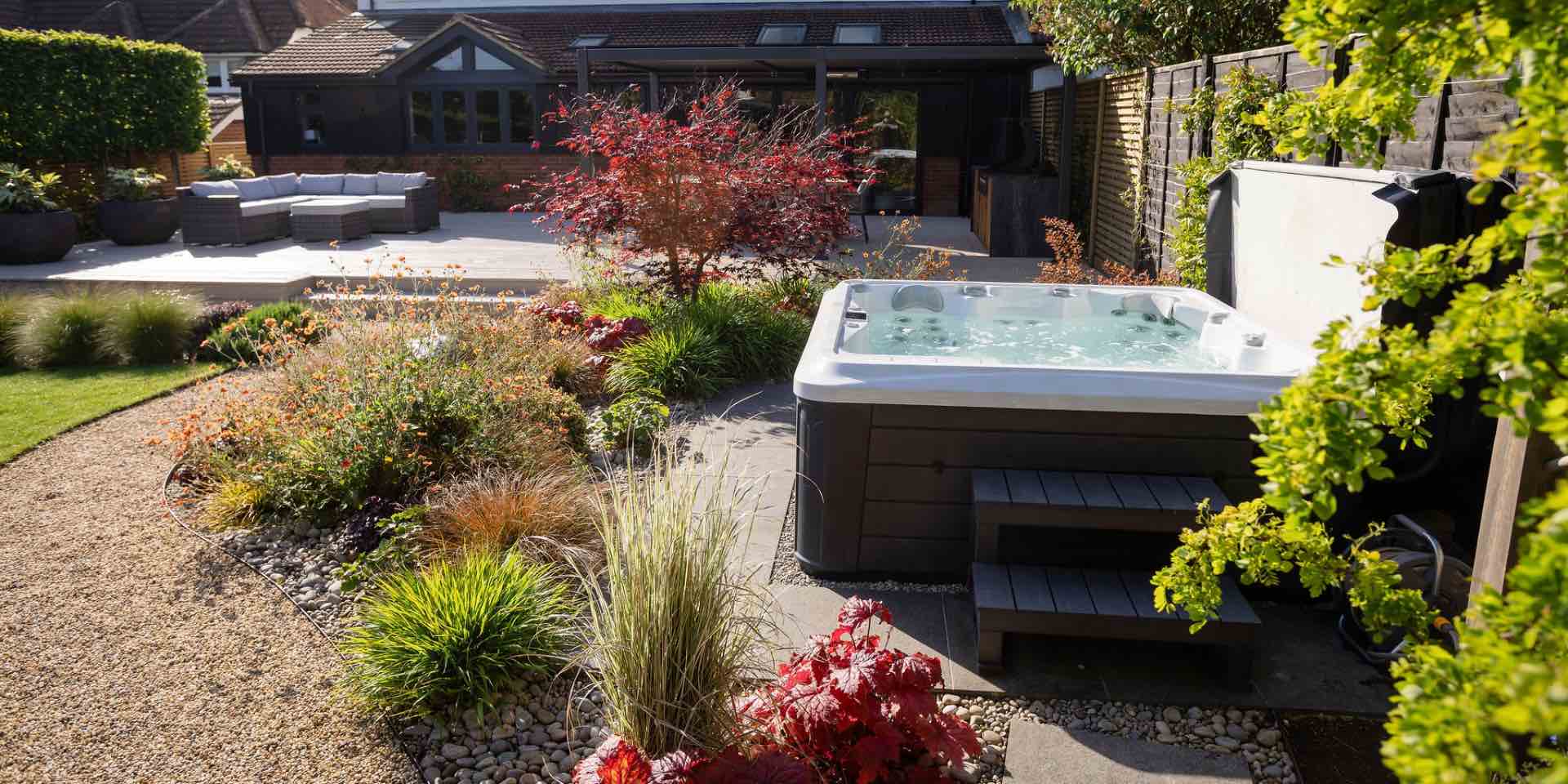 Garden design for country garden with composite deck, garden rooms and hot tub