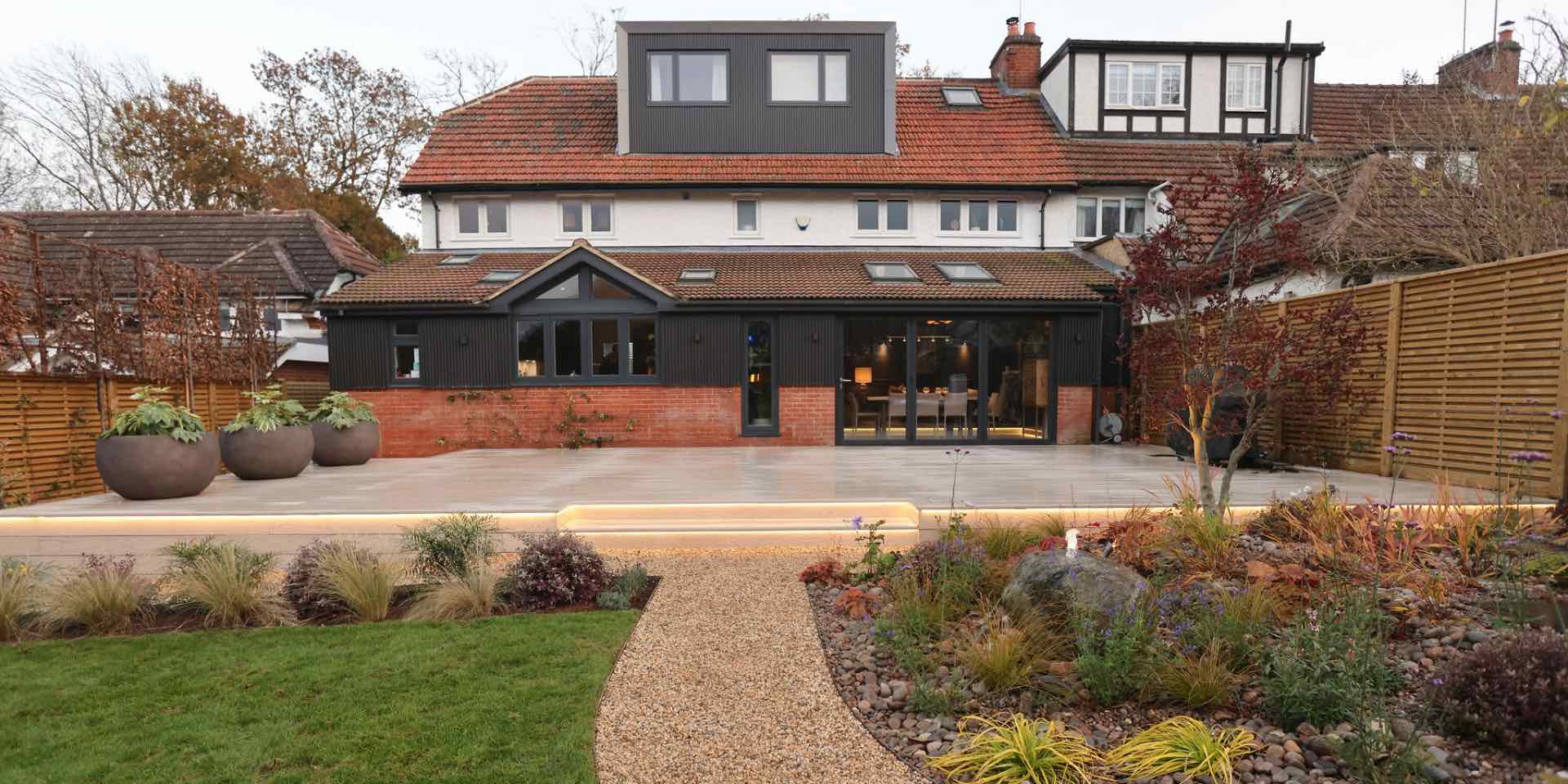 Park Hill Harpenden garden re-design with Millboard Composite Deck in limed oak with LED lighting and and wrap-around colourful planting