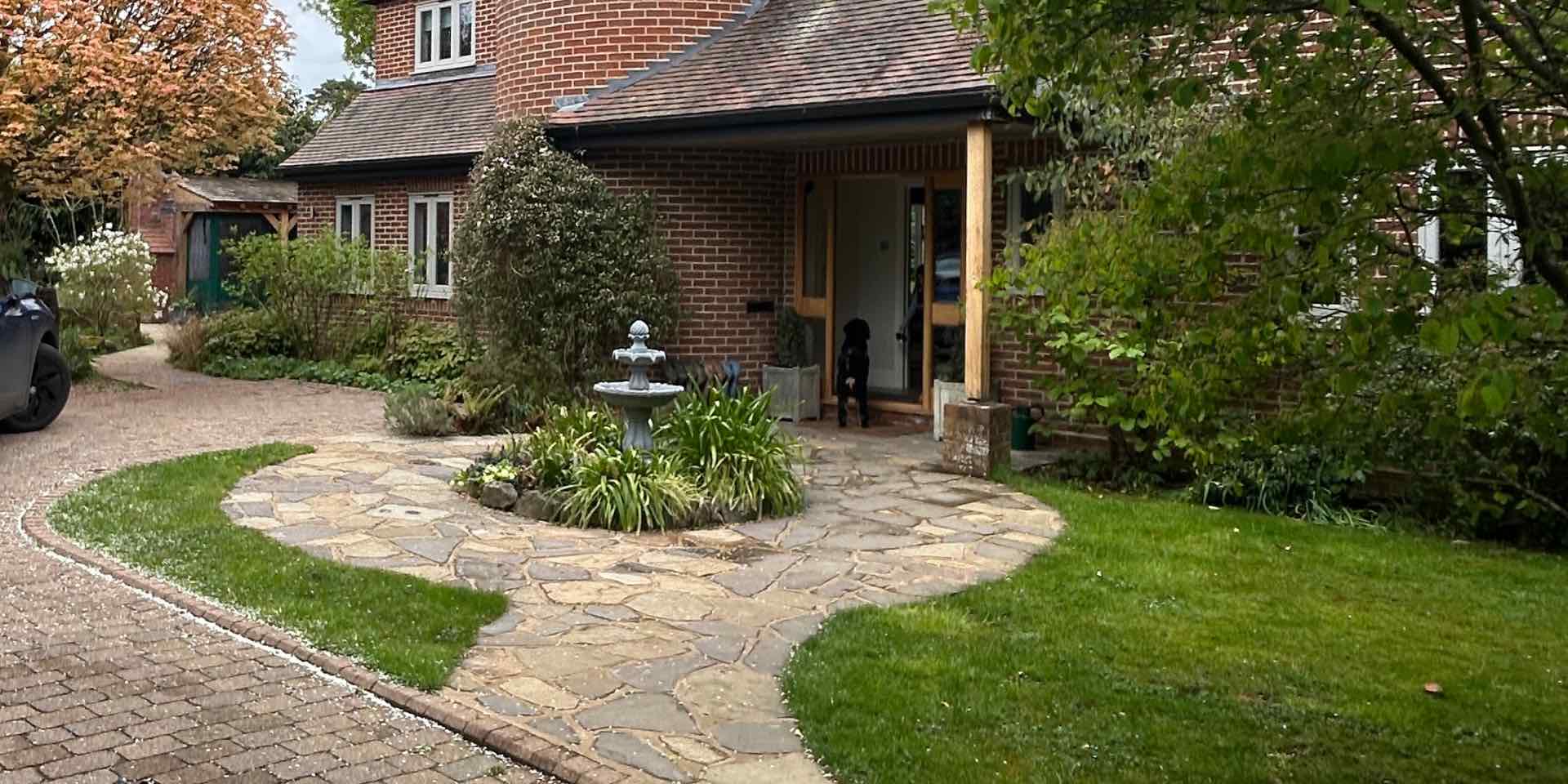 High Elms Harpenden Front Garden before redesign with dated water feature, block paving and overgrown garden