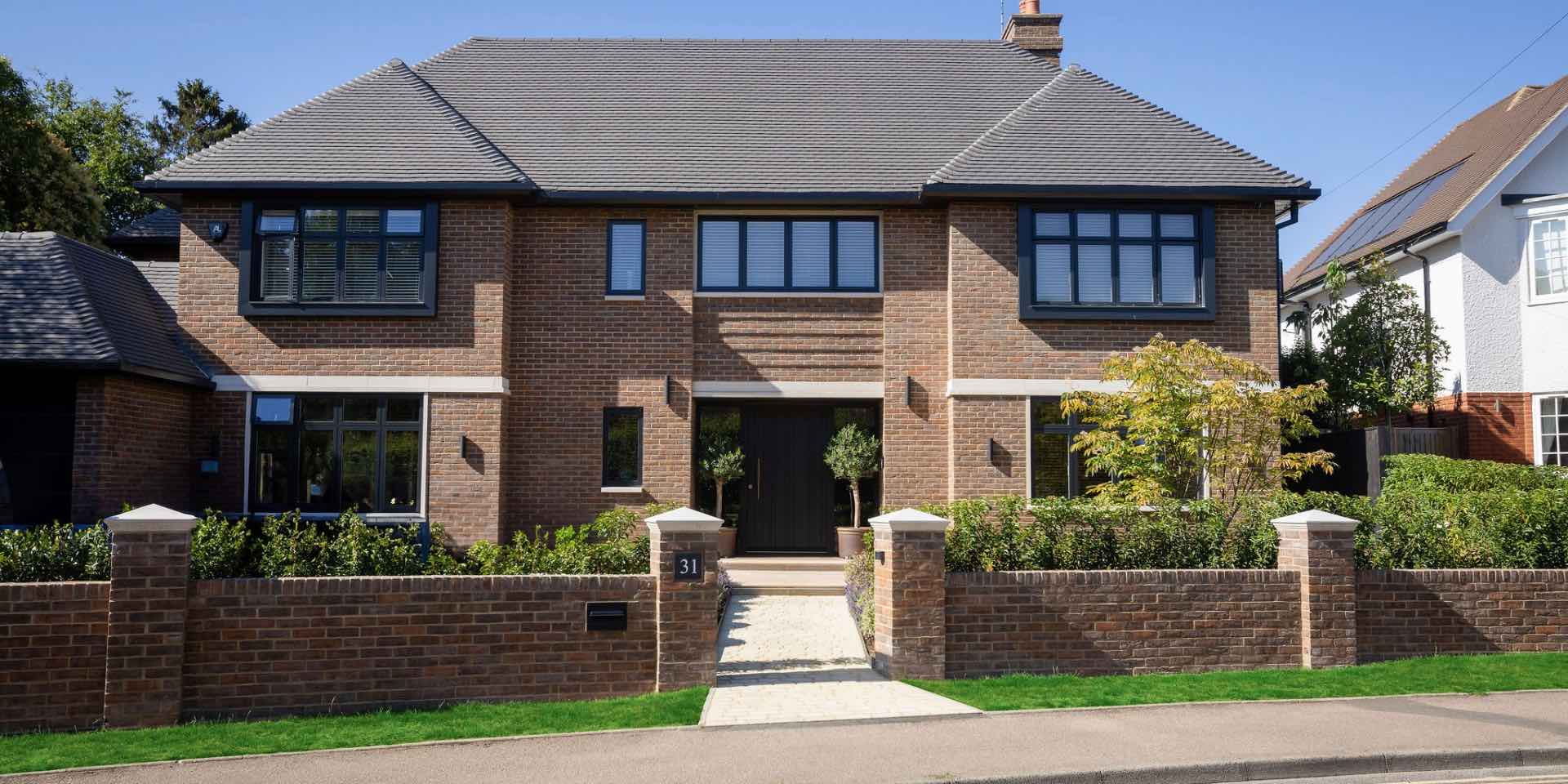 Luxury New Build Home in Harpenden with new boundary wall with pier caps and granite sett granite path