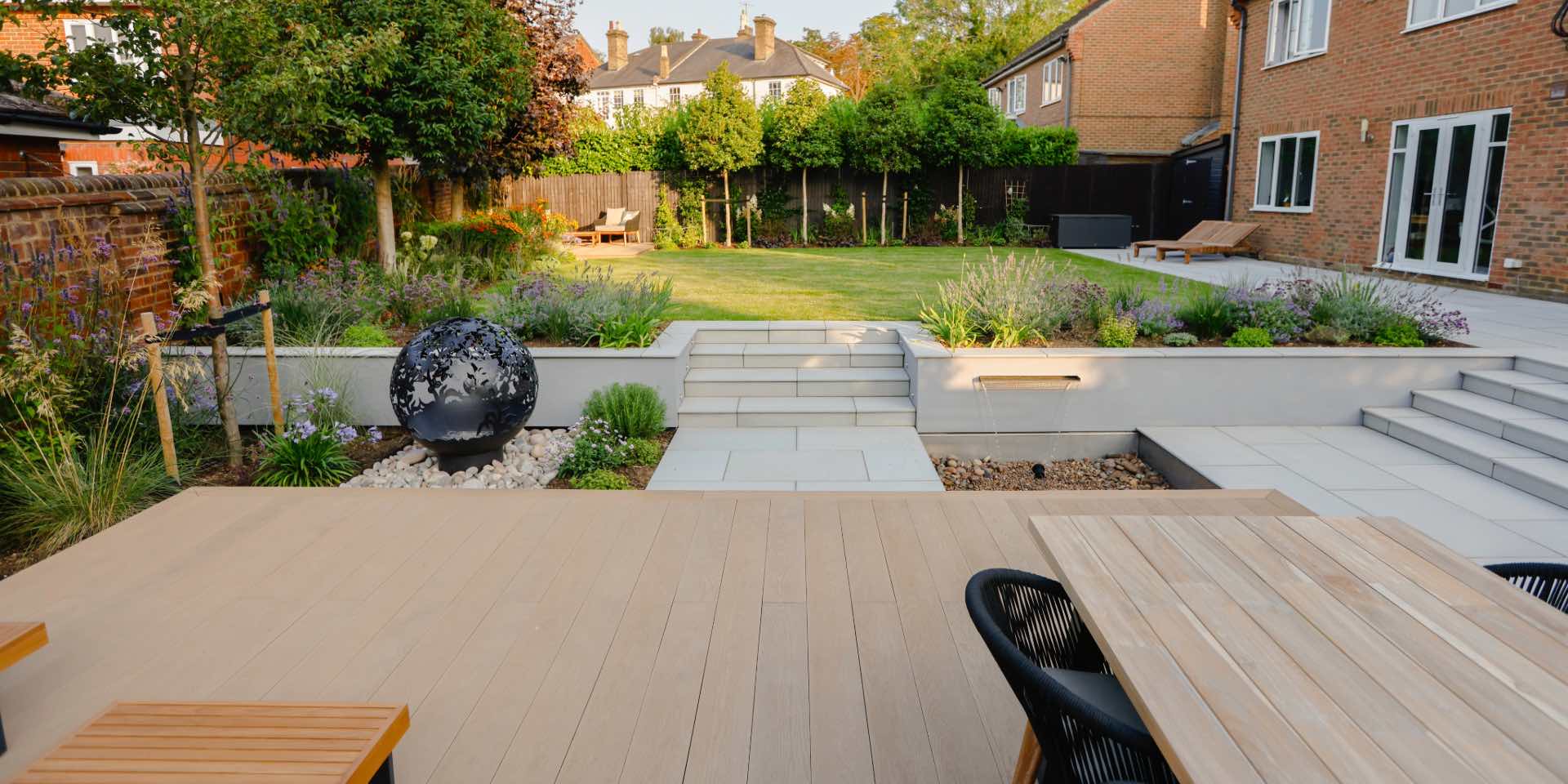 Hitchin contemporary garden steps leading to lawn