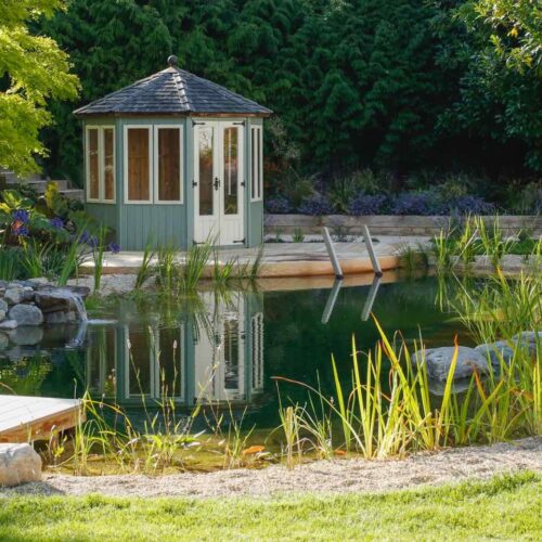 Large natural swimming pool with diving board